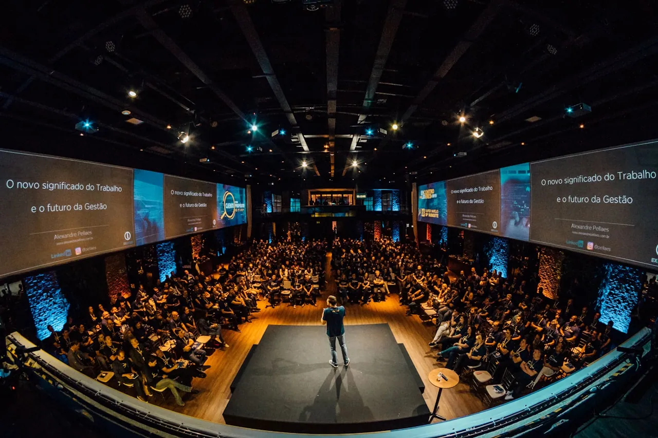 Conference venue with crowd and stage lighting